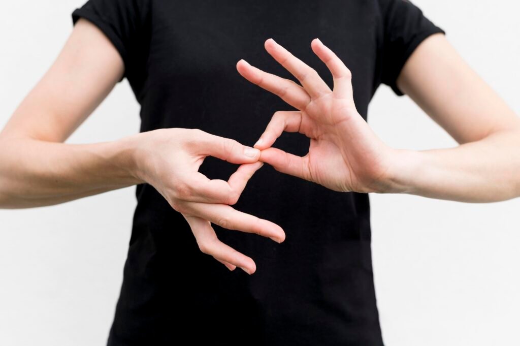 ASL interpreter using American Sign Language hand gestures during professional interpreting session