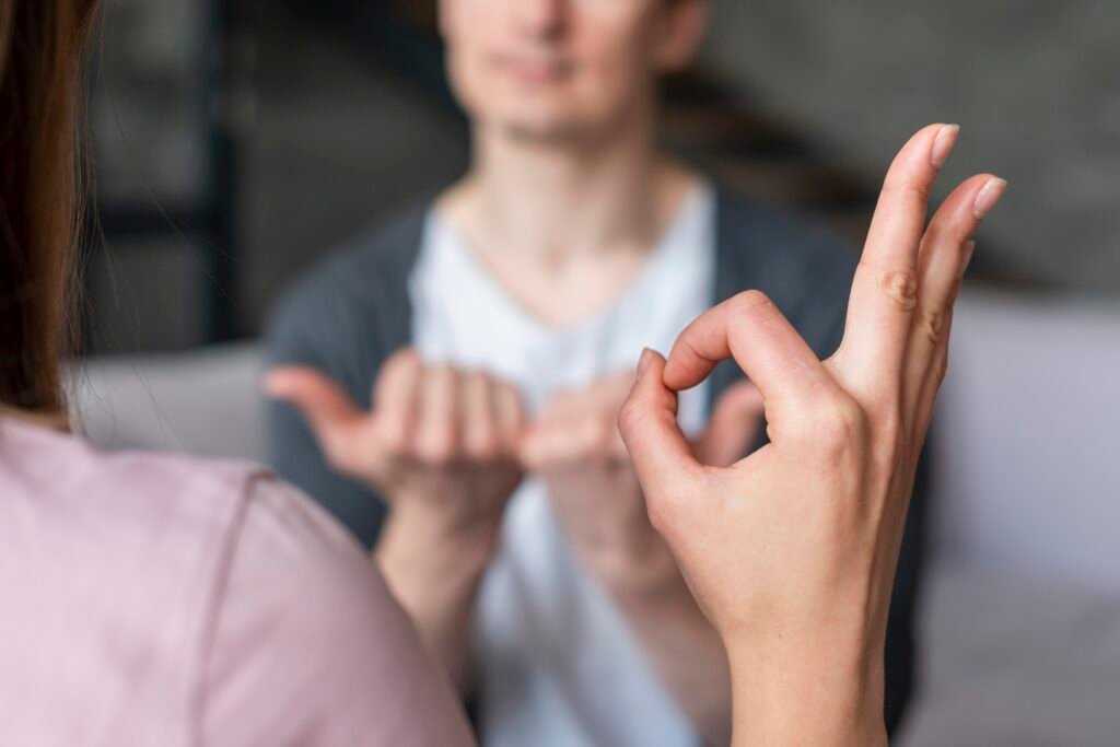2 ASL interpreter facilitating clear communication during a professional interpreting session