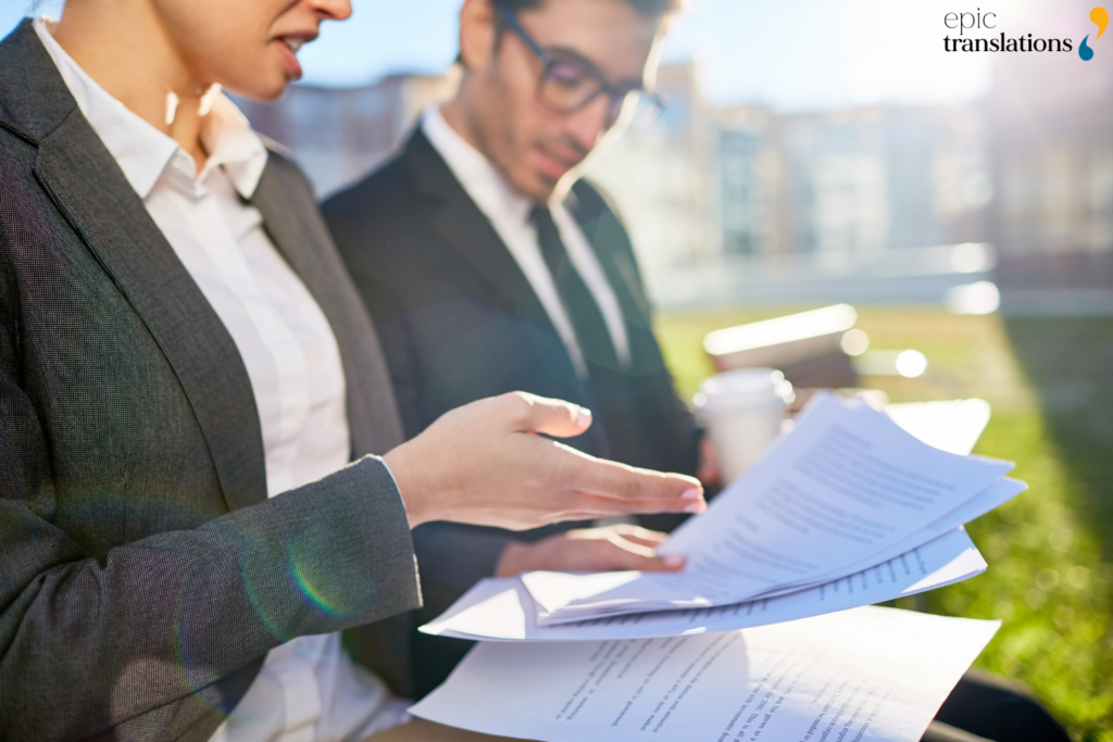 Compliance professionals reviewing regulatory documents to identify translation errors that can delay approvals and market entry