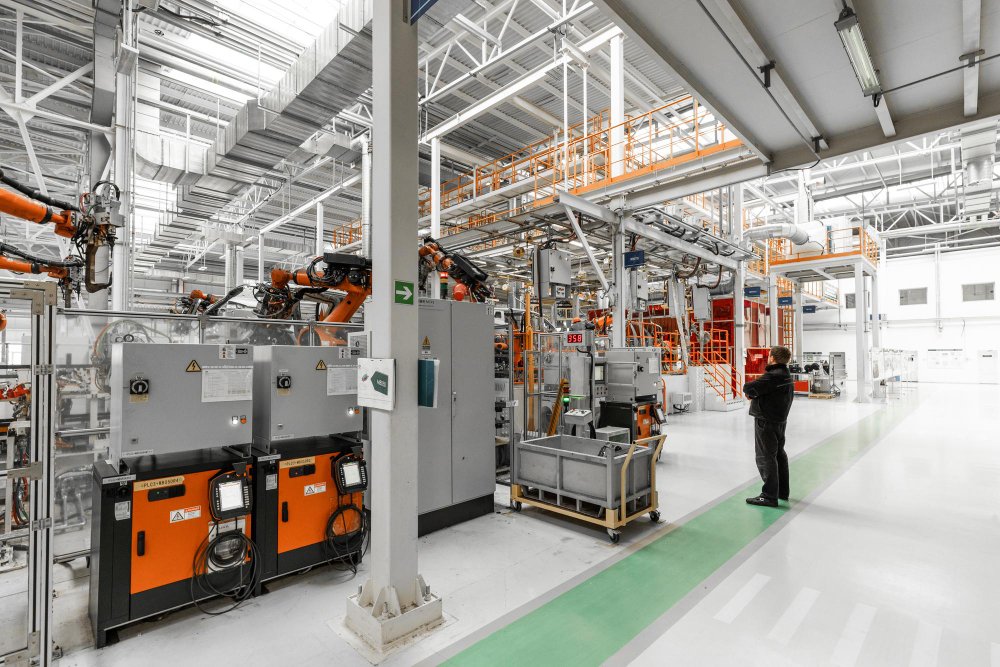 Automated manufacturing facility with industrial robots and production lines, representing industries that rely on export translation services for global manufacturing and international