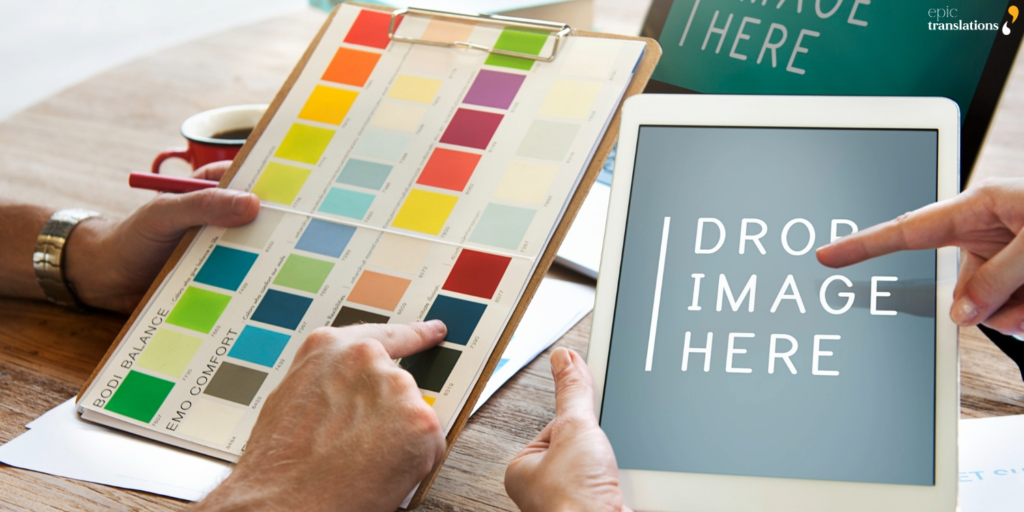 Creative team reviewing color swatches and digital layout concepts for multilingual desktop publishing and brand-consistent document design.
