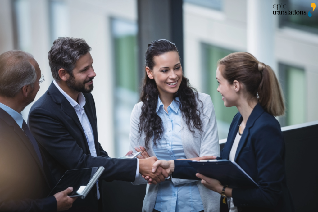 Business professionals establishing a strategic partnership with a language operations partner for multilingual communication and language access services.