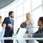 Business leaders collaborating with a language operations partner to improve multilingual communication, language access, and translation services.